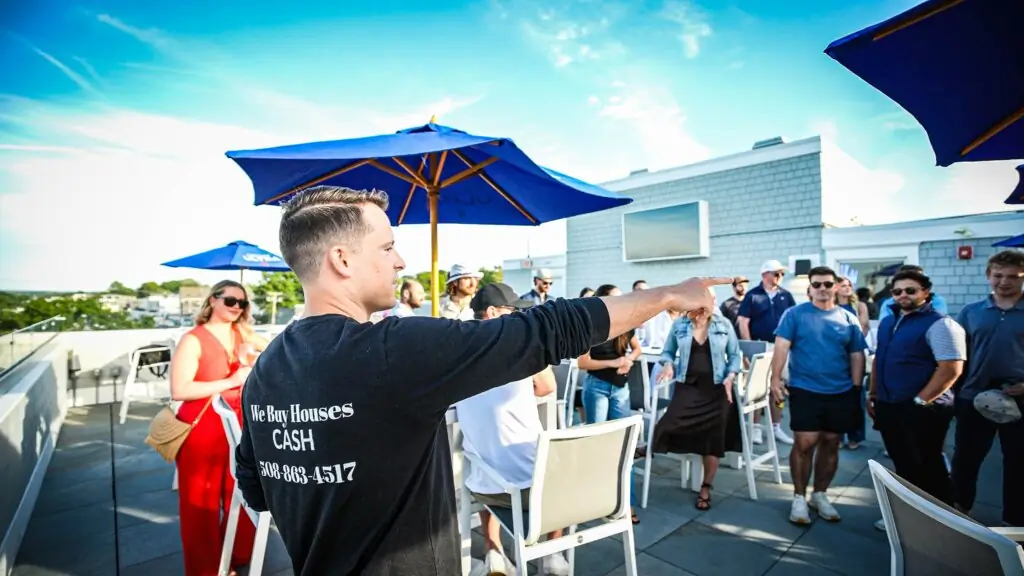 Devon pointing out something at a team gathering