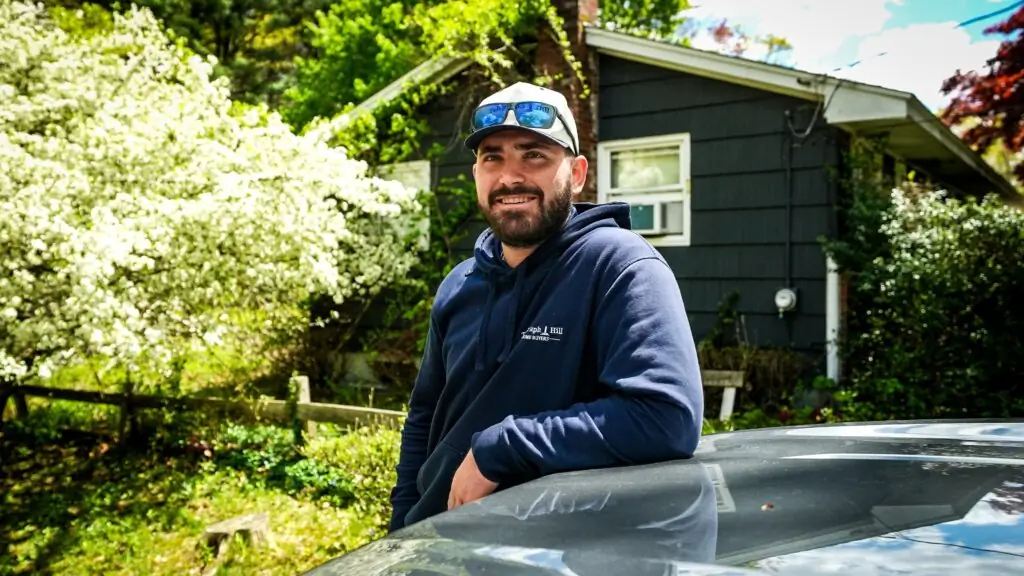 Jack outside a house the team is buying